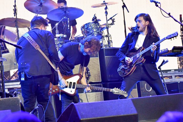 INGLEWOOD, CA - JANUARY 19: Bryce Dessner of The National (C) and Marcus Mumford, (L) and Winston Marshall (R) of Mumford & Sons perform onstage during iHeartRadio ALTer Ego 2018 at The Forum on January 19, 2018 in Inglewood, United States. (Photo by Jeff Kravitz/FilmMagic for iHeartRadio)