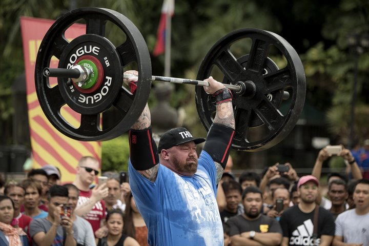 Bj&ouml;rnsson lifts weights during the Max Overhead competition.
