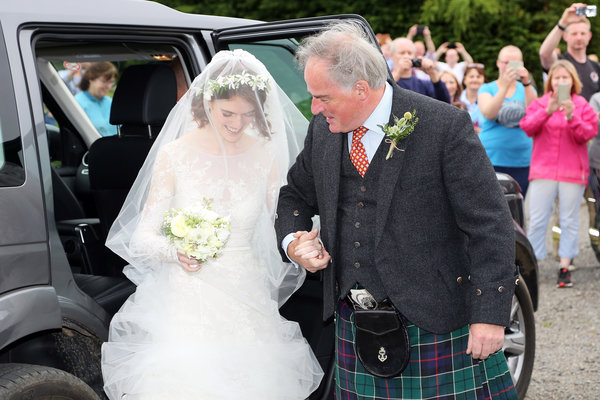 Rose Leslie arrives at the church with her father, Sebastian Leslie.