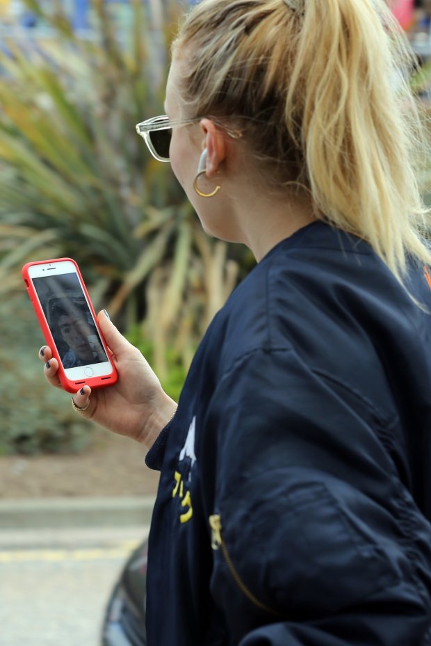 ABERDEEN, SCOTLAND - JUNE 22: Sophie Turner arriving at Aberdeen Airport facetiming Joe Jonas before the wedding of Kit Harrington and Rose Leslie on June 22, 2018 in Aberdeen, Scotland. (Photo by Mark Milan/GC Images)