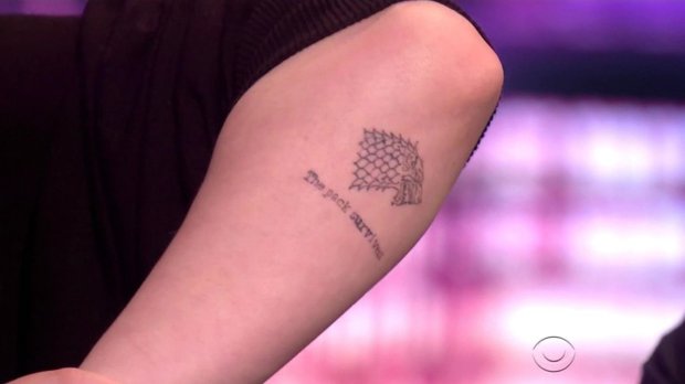 BGUK_1270435 - ** RIGHTS: WORLDWIDE EXCEPT IN UNITED STATES ** Los Angeles, CA - Sophie Turner denies her new Dire Wolf tattoo reveals the ending of Game of Thrones as she appears on The Late Late Show. The actress, who plays Sansa Stark in the hit show, showed off the new ink after host James Corden asked her about it. He commented that GoT fans were up in arms last week after it was revealed she got the tattoo, with many of them thinking the words she had inked under the wolf - The Pack Survives - was a reveal of how the show would end. But Turner denied she had given anything away, saying: "It's a Dire Wolf and it says The Pack Survives. Actually while I was getting it done people advised me not to because it looked like I was giving everything away. But I wasn't. It's just a quote from last season but everyone figures the pack really does survive. It's just a moral I like to live by!" Corden then told her: "Put us out of our misery and tell up how the upcoming season ends." Turner just laughed and quipped: "I'll just get it tattooed on my forehead next time!" Later in the show Turner confessed her love for the rapper Eminem and showed off her own rapping skills as she rapped the entire Eminem song The Real Slim Shady, much to the surprise of Corden and fellow guest and Foo Fighter Dave Grohl. *BACKGRID DOES NOT CLAIM ANY COPYRIGHT OR LICENSE IN THE ATTACHED MATERIAL. ANY DOWNLOADING FEES CHARGED BY BACKGRID ARE FOR BACKGRID'S SERVICES ONLY, AND DO NOT, NOR ARE THEY INTENDED TO, CONVEY TO THE USER ANY COPYRIGHT OR LICENSE IN THE MATERIAL. BY PUBLISHING THIS MATERIAL , THE USER EXPRESSLY AGREES TO INDEMNIFY AND TO HOLD BACKGRID HARMLESS FROM ANY CLAIMS, DEMANDS, OR CAUSES OF ACTION ARISING OUT OF OR CONNECTED IN ANY WAY WITH USER'S PUBLICATION OF THE MATERIAL* Pictured: Sophie Turner BACKGRID UK 22 JUNE 2018 BYLINE MUST READ: CBS / BACKGRID UK: +44 208 344 2007 / uksales@backgrid.com USA: +1 310 798 9111 / usasales@backgrid.com *UK Clients - Pictures Containing Children Please Pixelate Face Prior To Publication*