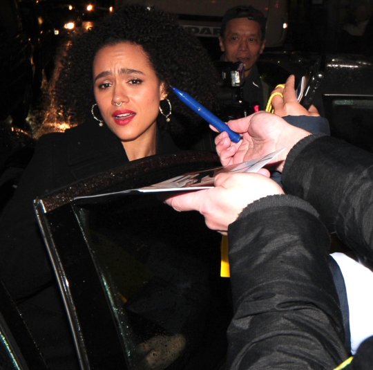 Nathalie Emmanuel is clearly physically shaken and close to tears when autograph hunters surround her demanding autographs and putting pens in her face at the La Boheme - VIP performance at the london coliseum, something was said to her as she tried to get into her car and she just wanted to get away from the pack of autographers. one nice fan gave her a present of m and m sweets, once safely in the car she signed for a few collectors