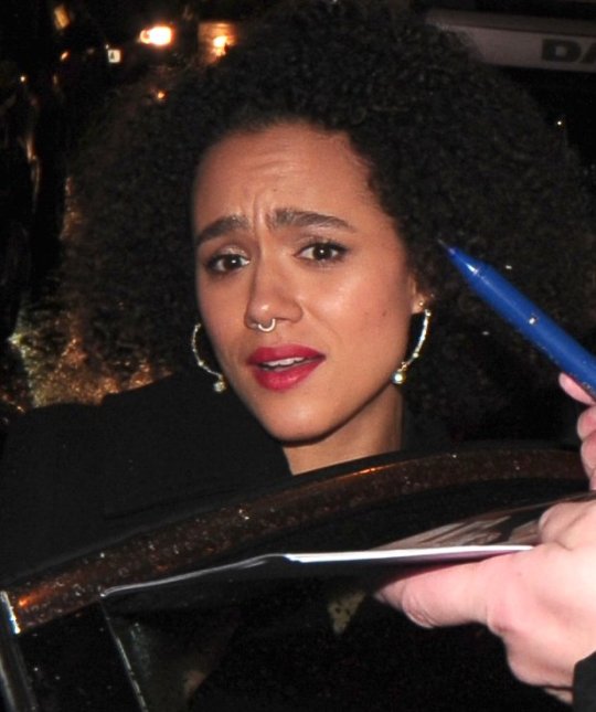 Nathalie Emmanuel is clearly physically shaken and close to tears when autograph hunters surround her demanding autographs and putting pens in her face at the La Boheme - VIP performance at the london coliseum, something was said to her as she tried to get into her car and she just wanted to get away from the pack of autographers. one nice fan gave her a present of m and m sweets, once safely in the car she signed for a few collectors
