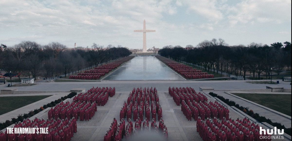 Image of women in red gowns lined up in rows on the National Mall