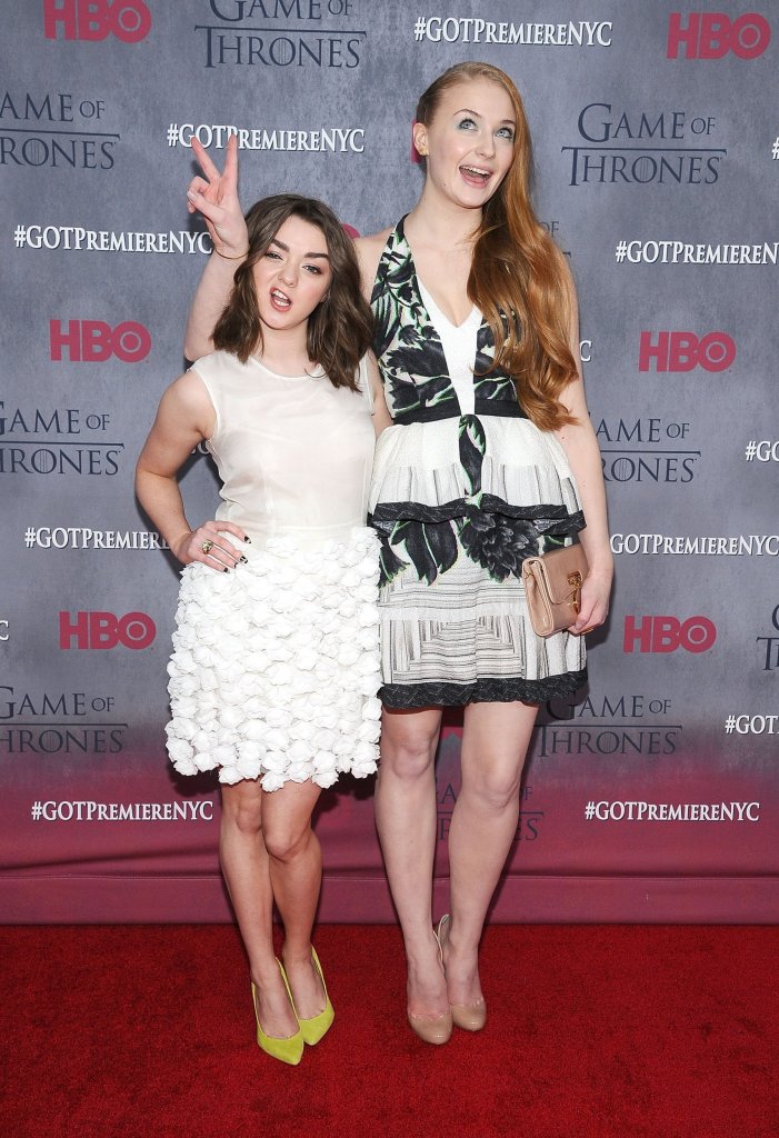 NEW YORK, NY - MARCH 18: Maisie Williams (L) and Sophie Turner attend the "Game Of Thrones" Season 4 premiere at Avery Fisher Hall, Lincoln Center on March 18, 2014 in New York City. (Photo by Gary Gershoff/WireImage)