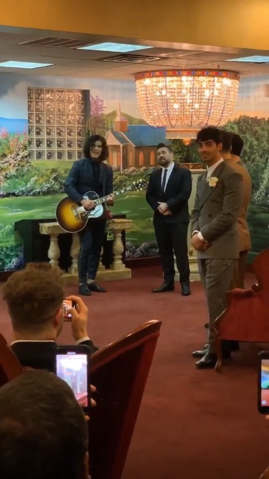 Joe Jonas waits for Sophie Turner at their Las Vegas wedding