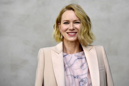 Naomi Watts wearing a pink dress and jacket