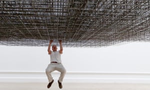 Antony Gormley poses with his installation Matrix III