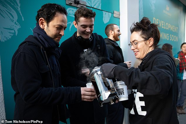 Doing good: Game Of Thrones' Lena Headey, 46, smiled and chatted to the people queuing outside the Covent Garden Help Refugees shop
