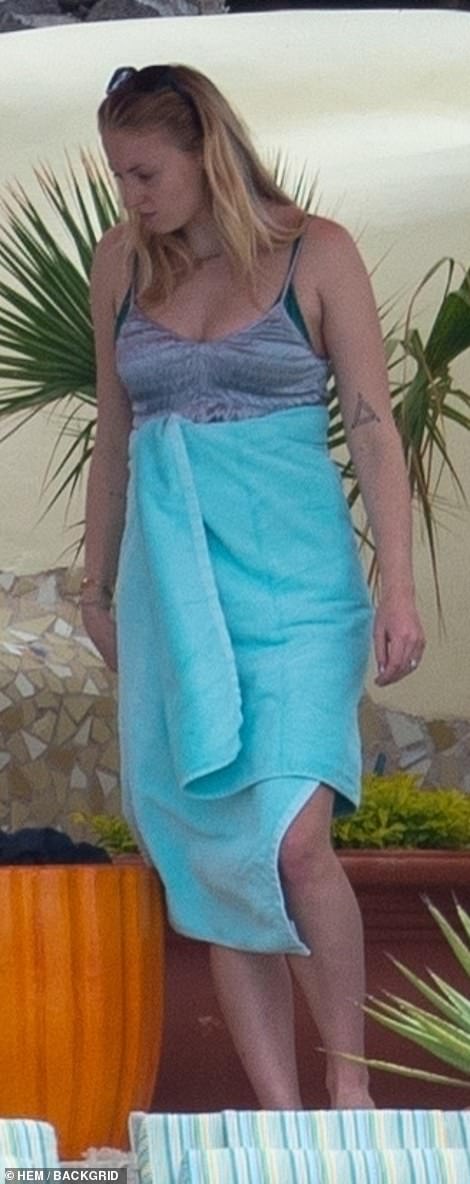 Cover up: Turner had a light blue towel wrapped around her torso at one point during the party
