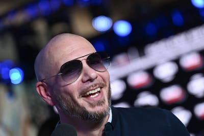 Pitbull smiles at the camera on radio row for Super Bowl LIV on Jan. 31 at the Miami Beach Convention Center in Miami.