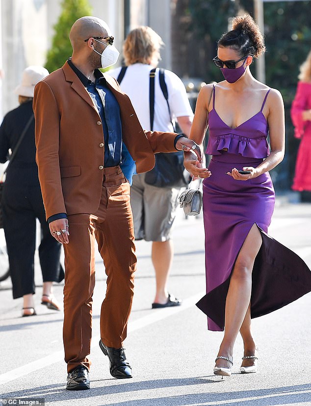 Handsome couple: She attended the 77th Venice Film Festival with her actor beau, 39, who looked dapper in a chocolate-coloured suit and navy shirt