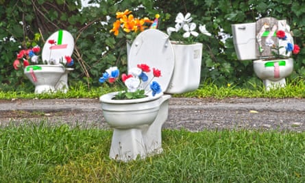 Hank Robar, the owner of three Potsdam properties, has been battling the village over a display of toilets and urinals filled with bright flowers,