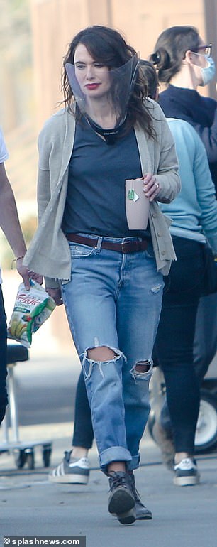 Casual cool: Lena looked sensational in her casual ensemble paired with raven curls