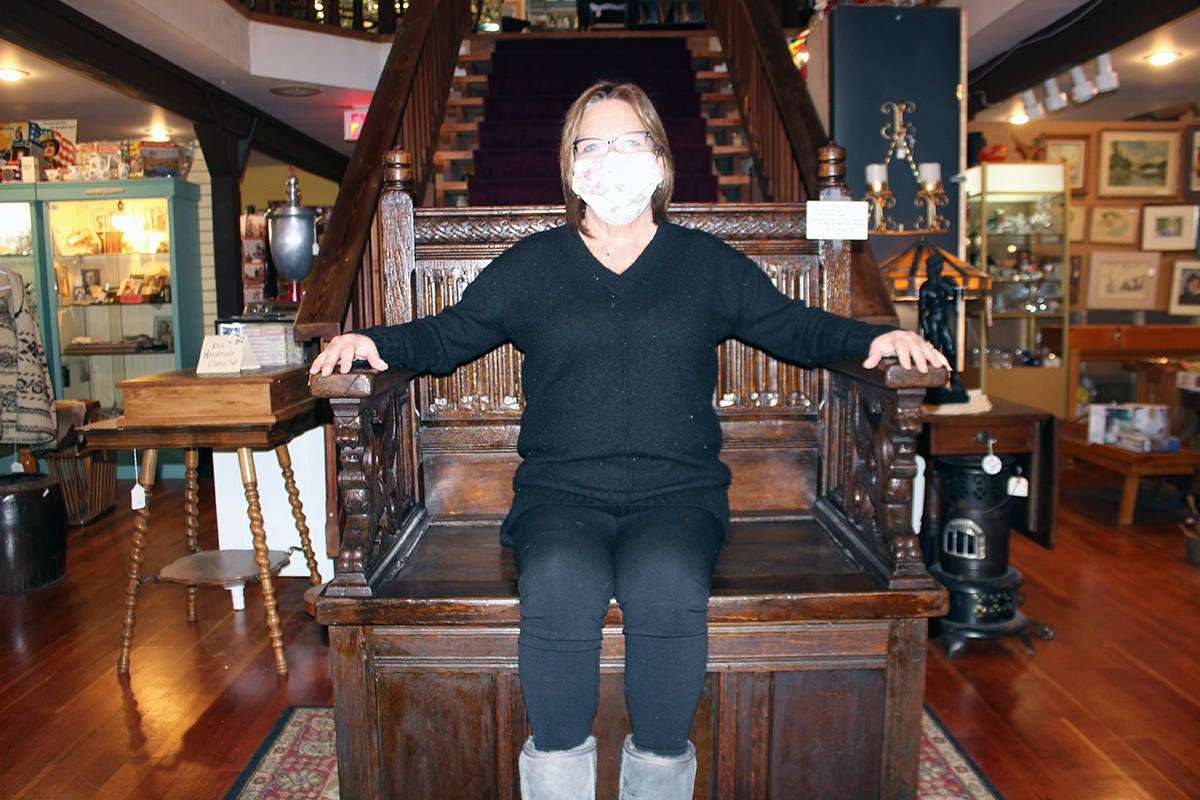 THRONE ALONE
Sherryl Zacher at the Antique Barn on the Trans-Canada HIghway tests out a throne used in Season 8 of Game of Thrones. It’s available for a mere $12,500 and is open to offers. The sturdy throne came from a castle outside of Cardiff, Wales and was made between 1680 and 1690. It was one of the thrones from the Game of Thrones during that season. (Photo by Don Bodger)