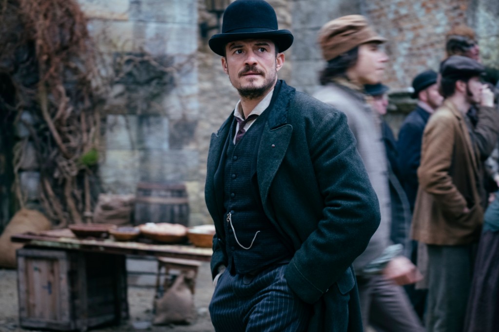 Orlando Bloom wearing a bowler hat in "Carnival Row." 