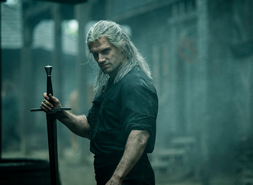 Henry Cavill holds a sword in "The Witcher." 