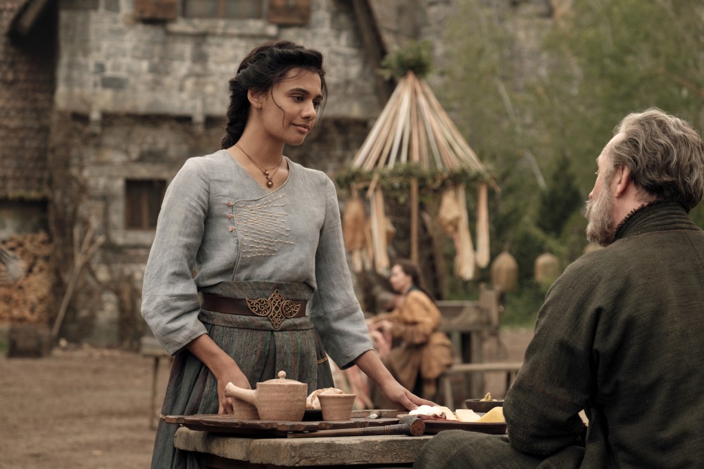 Egwene (Madeleine Madden) stands outside in her village in "The Wheel of Time." 