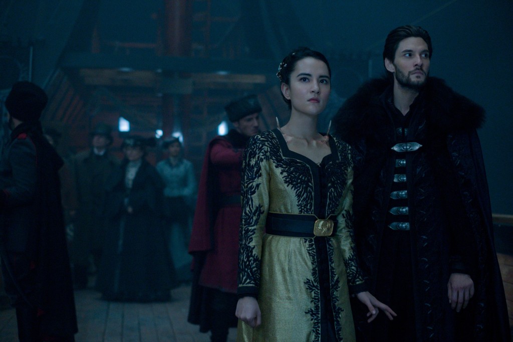 Jessie Mei Li as Alina and Ben Barnes as The Darkling stand next to each other on a ship deck in "Shadow and Bone." 