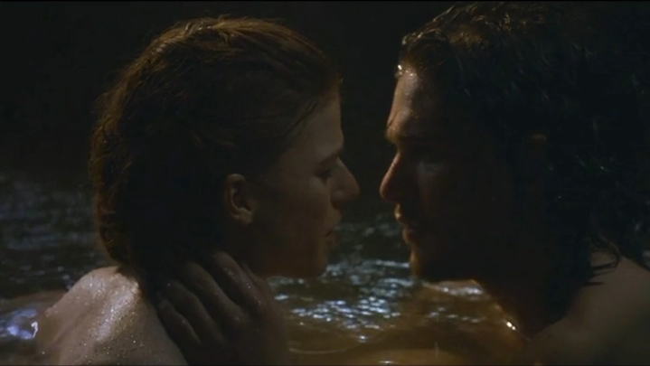 Ygritte and Jon bathing together in a cave.