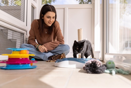 Undated handout photo of Emily Carey with Squid the kitten who was found in a van engine at nine weeks old, during her visit to the Blue Cross rehoming centre in Kimpton, Hertfordshire. Issue date: Tuesday October 11, 2022. PA Photo The House Of The Dragon star, met animals and staff at the centre, speaking to them about the work they do for the Blue Cross, a national animal charity which is celebrating its 125th anniversary this year and provides care for sick, injured and homeless pets. See PA story ANIMALS Carey. Photo credit should read: Nigel Davies/PA Wire NOTE TO EDITORS: This handout photo may only be used in for editorial reporting purposes for the contemporaneous illustration of events, things or the people in the image or facts mentioned in the caption. Reuse of the picture may require further permission from the copyright holder.