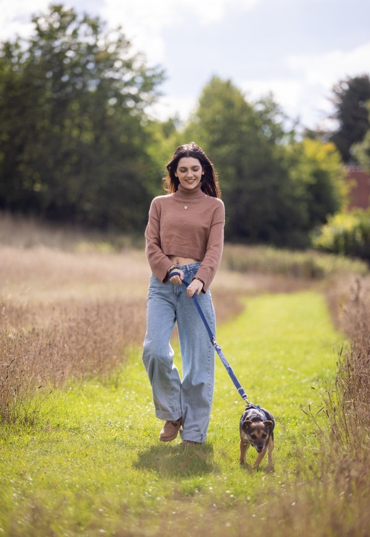 Undated handout photo of Emily Carey walking 7-year-old dog Tilly, during her visit to the Blue Cross rehoming centre in Kimpton, Hertfordshire. Issue date: Tuesday October 11, 2022. PA Photo. The House Of The Dragon star, met animals and staff at the centre, speaking to them about the work they do for the Blue Cross, a national animal charity which is celebrating its 125th anniversary this year and provides care for sick, injured and homeless pets. See PA story ANIMALS Carey. Photo credit should read: Nigel Davies/PA Wire NOTE TO EDITORS: This handout photo may only be used in for editorial reporting purposes for the contemporaneous illustration of events, things or the people in the image or facts mentioned in the caption. Reuse of the picture may require further permission from the copyright holder.