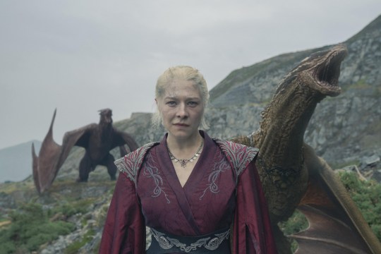 Emma D'Arcy as Rhaenyra Targaryen in House of the Dragon standing in front of two of her dragons