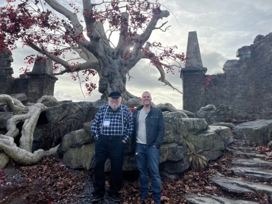 George RR Martin and Ryan Condal stood on the set of House of the Dragon season 2